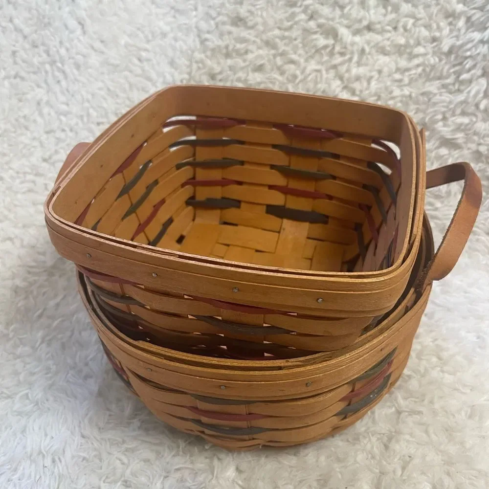 Longaberger 1995 set of two Handcrafted round and Square Woven baskets .